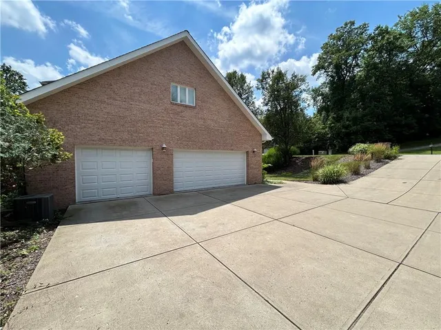 a front view of house with garage