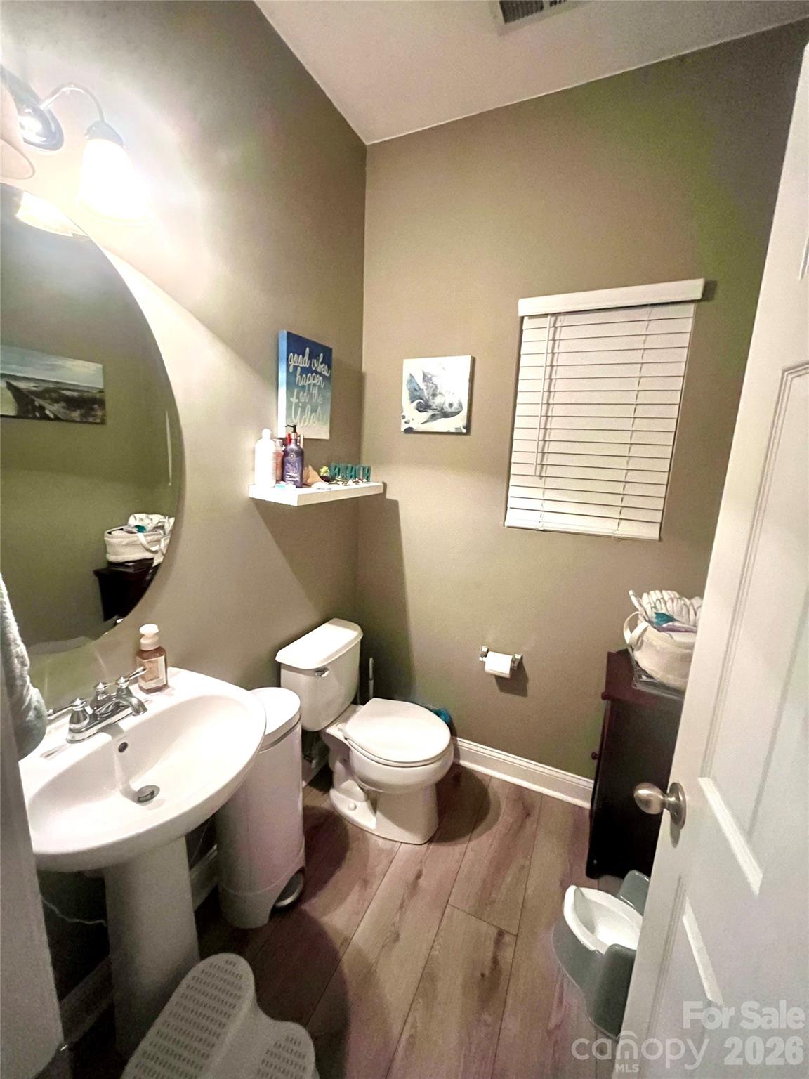 226 Waterlemon Way Monroe, NC 28110 - Photo 17 of 29 a bathroom with a sink toilet and a mirror