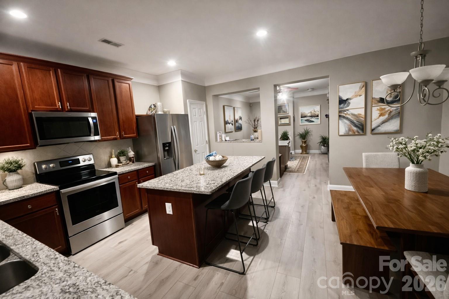 226 Waterlemon Way Monroe, NC 28110 - Photo 2 of 29 a kitchen with granite countertop lots of counter top space and stainless steel appliances