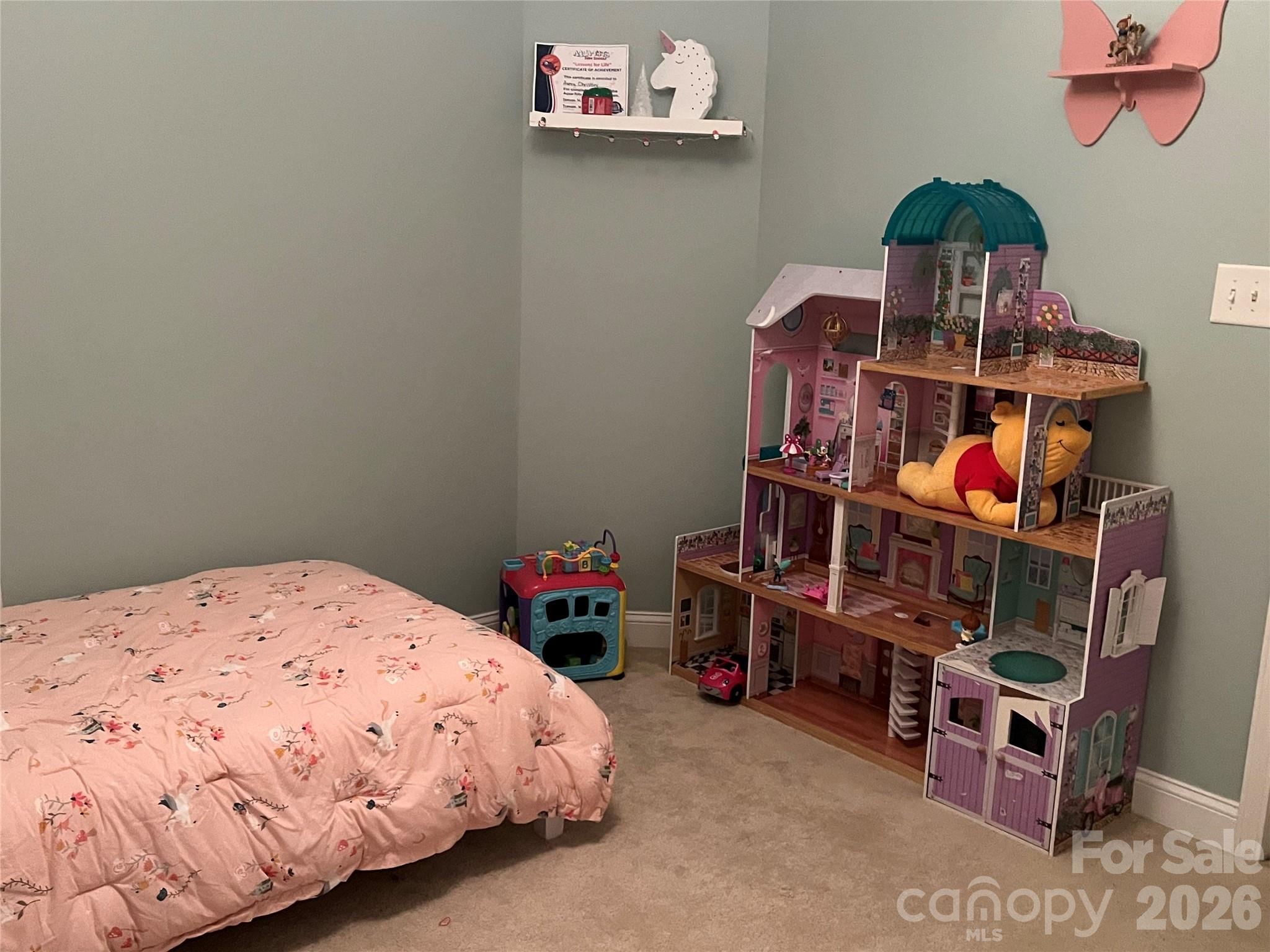 226 Waterlemon Way Monroe, NC 28110 - Photo 26 of 29 a bed sitting in a bedroom next to a window