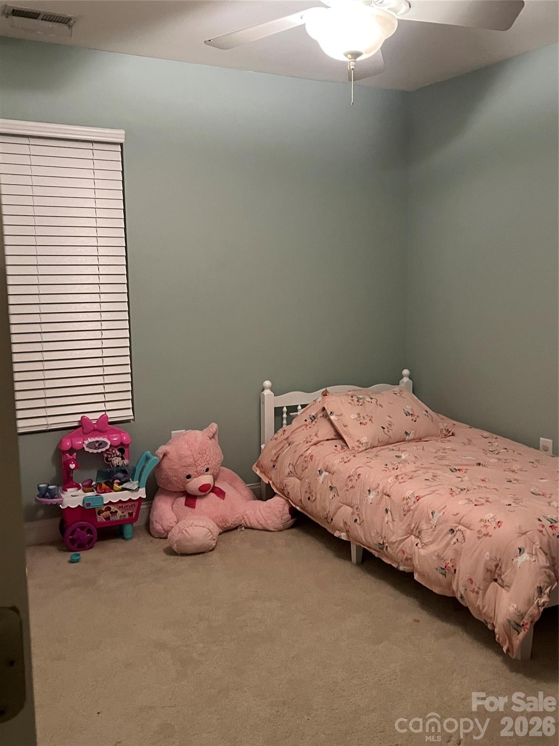 226 Waterlemon Way Monroe, NC 28110 - Photo 27 of 29 a bedroom with a bed and a window