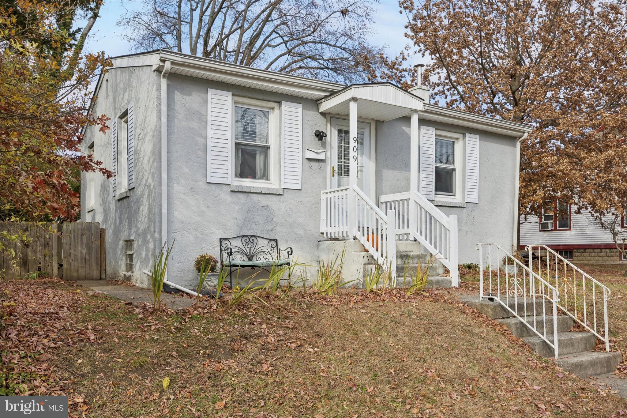 909 Walnut Street Collingdale, PA 19023 - Photo 2 of 15 a view of a house with a yard and wooden fence