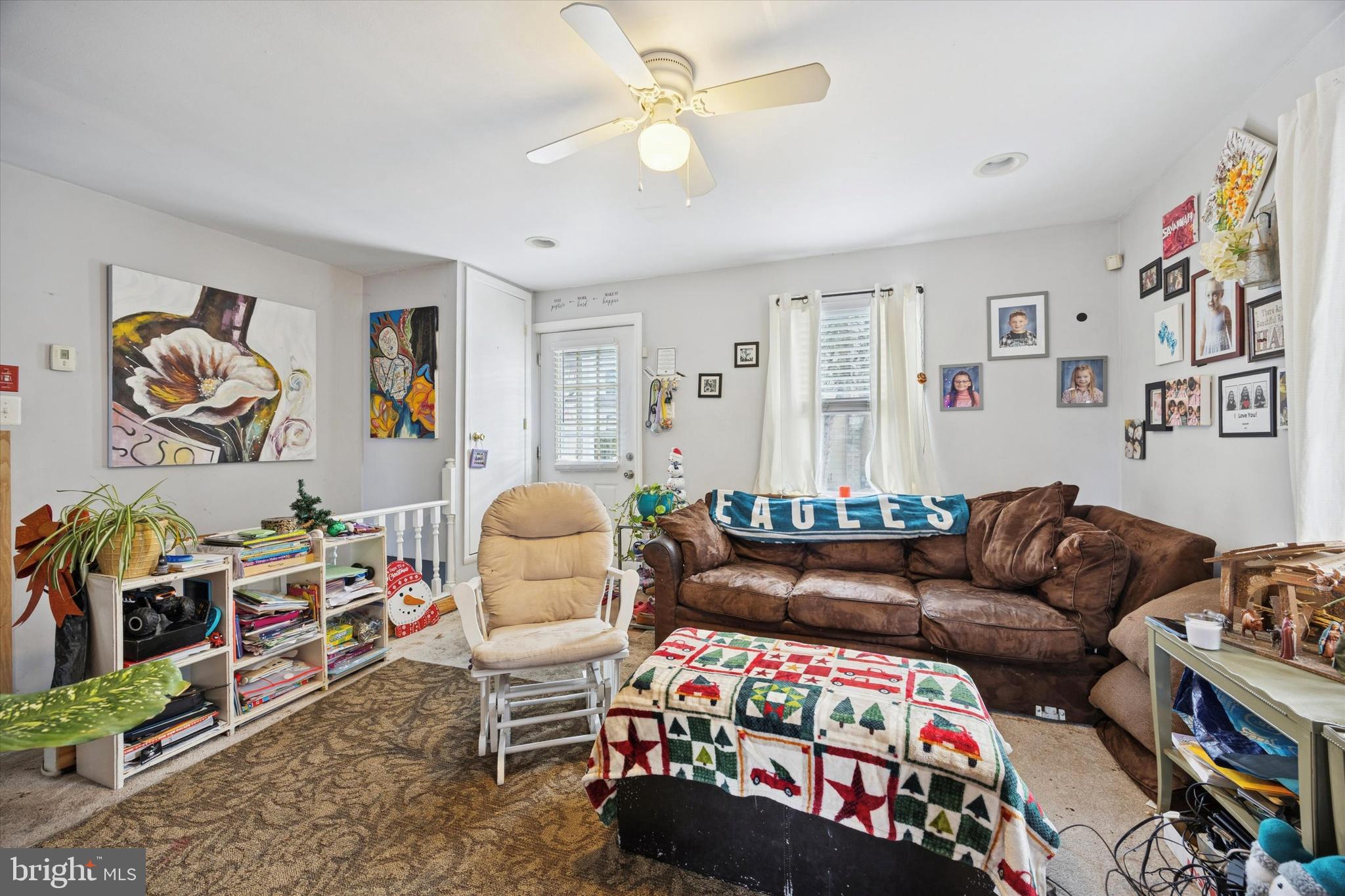 909 Walnut Street Collingdale, PA 19023 - Photo 4 of 15 a bedroom with furniture and a couch