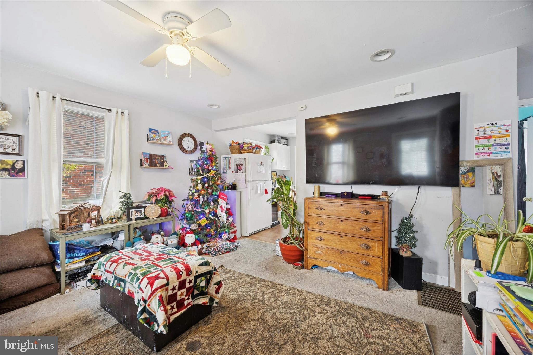 909 Walnut Street Collingdale, PA 19023 - Photo 5 of 15 a bedroom with furniture a flat screen tv and a window