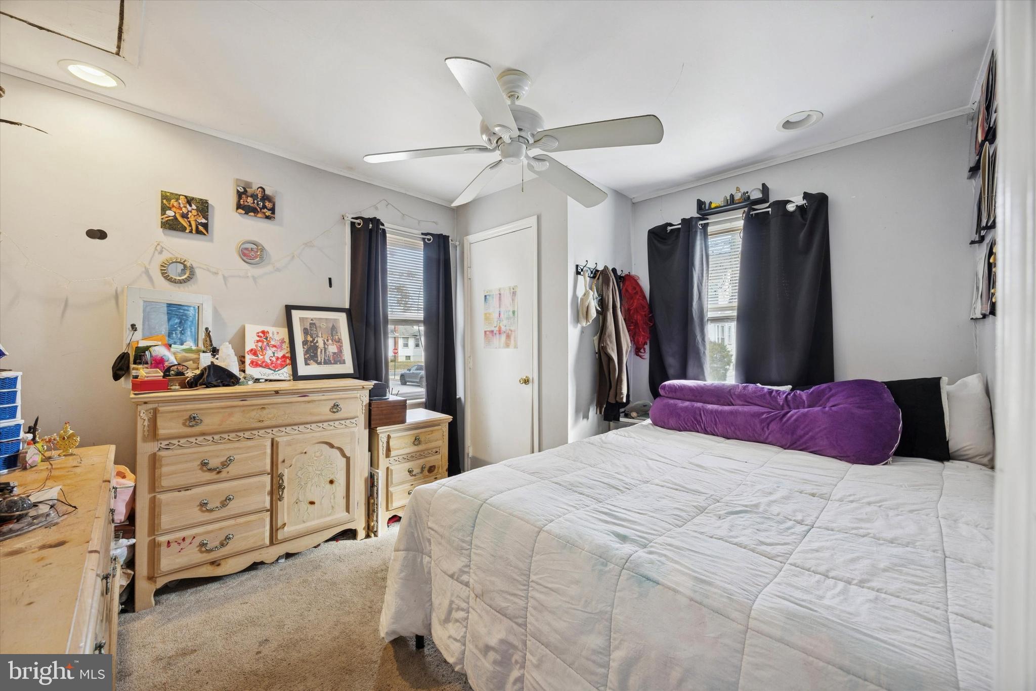 909 Walnut Street Collingdale, PA 19023 - Photo 8 of 15 a bedroom with a bed a dresser and a mirror