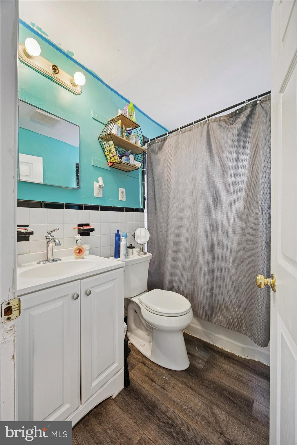 909 Walnut Street Collingdale, PA 19023 - Photo 10 of 15 a bathroom with a sink and a mirror