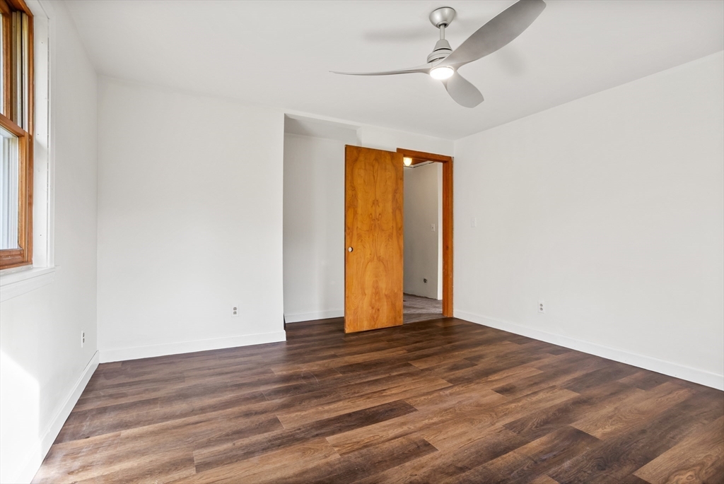 16 Neale Road Royalston, MA 01368 - Photo 22 of 38 an empty room with wooden floor and windows