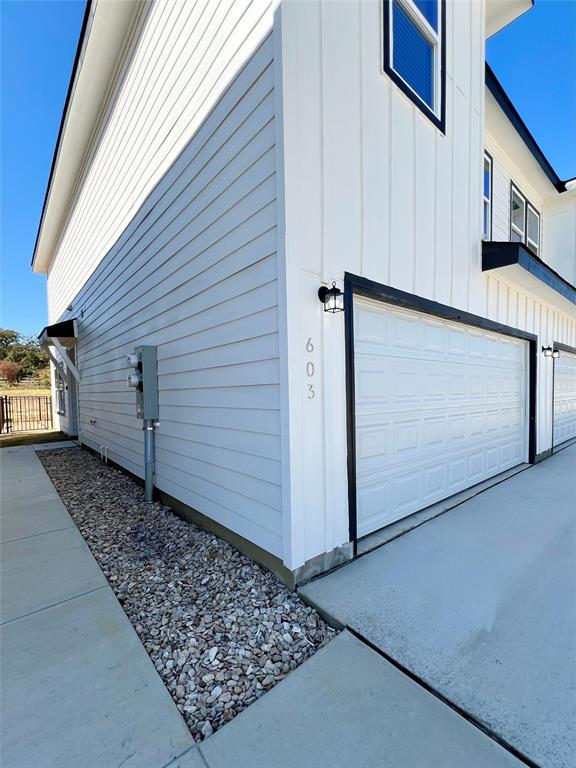 3501 East Renfro Street, Unit 603 Burleson, TX 76028 - Photo 2 of 35 a view of a garage