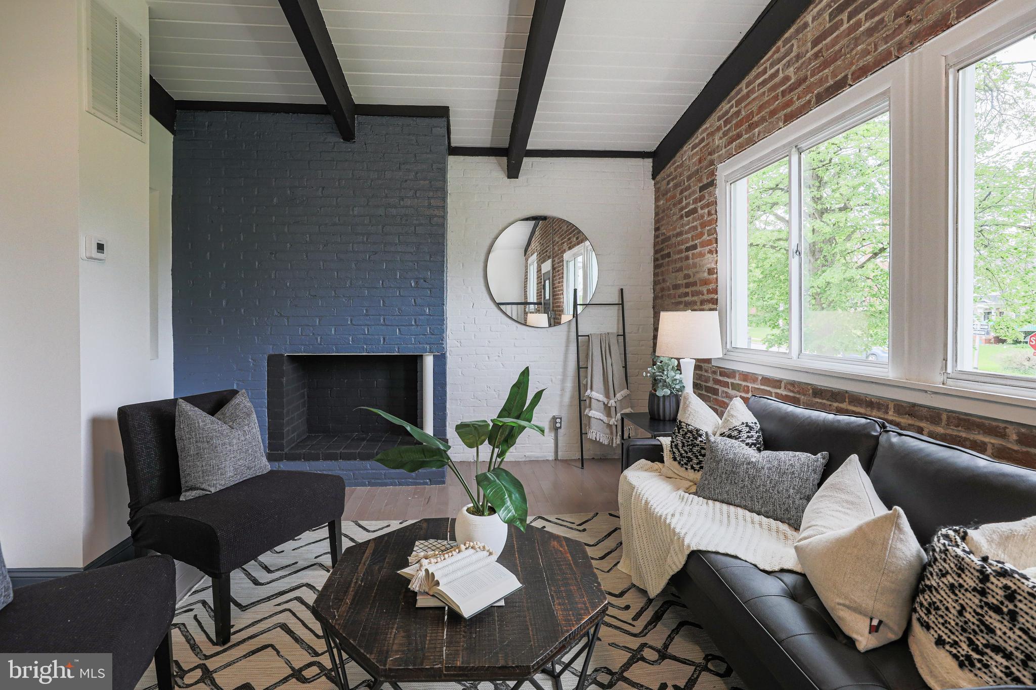 4100 Alto Road Baltimore, MD 21216 - Photo 5 of 33 a living room with furniture and a fireplace