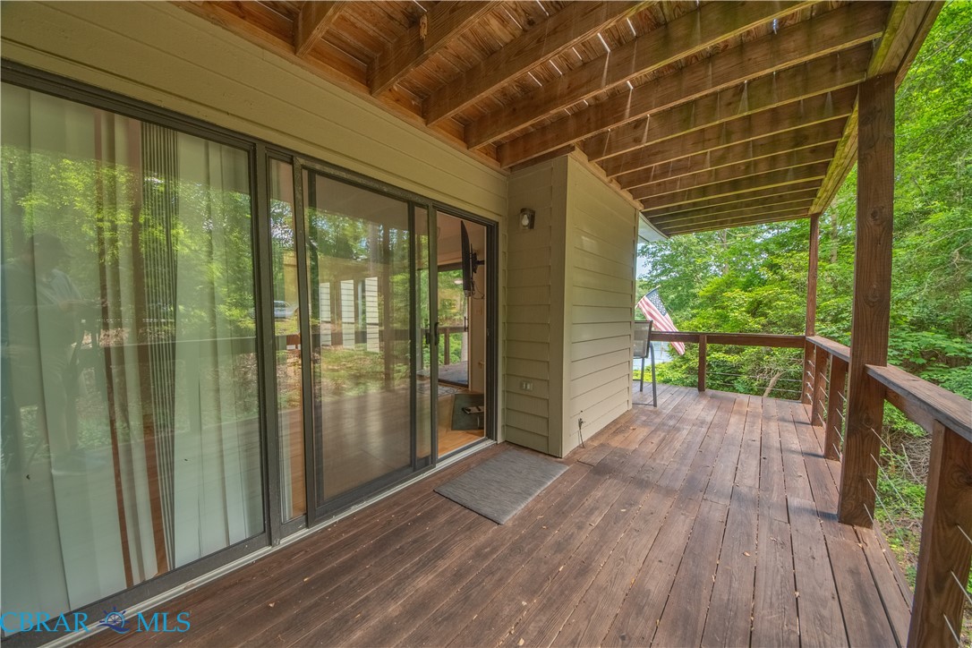54 Villa Ridge Drive, Unit C Hartfield, VA 23071 - Photo 5 of 45 View of wooden deck
