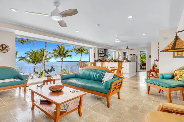 a living room with furniture a rug and a flat screen tv