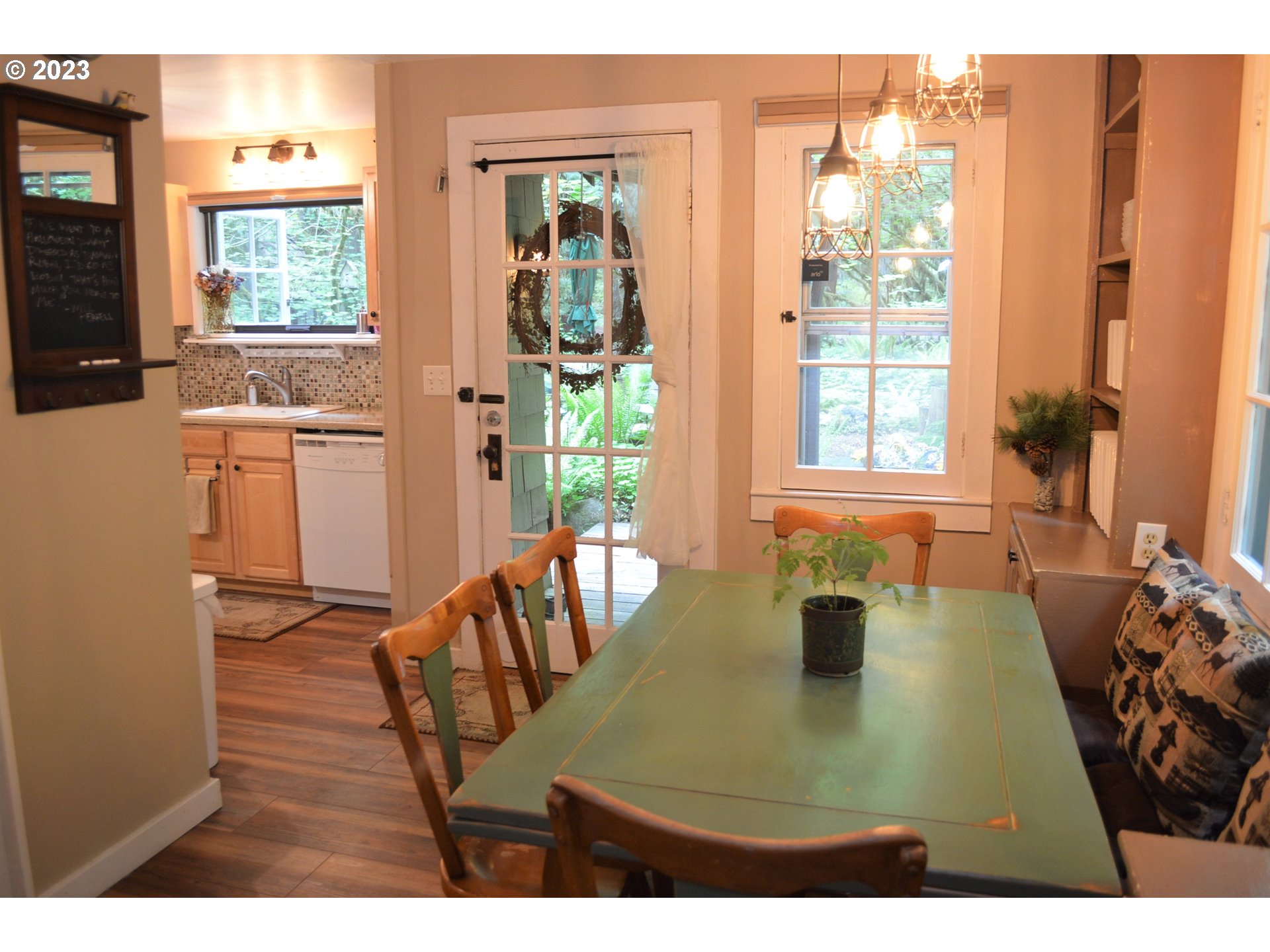 27502 Road 20 Rhododendron, OR 97049 - Photo 11 of 48 a view of a dining room with furniture and wooden floor