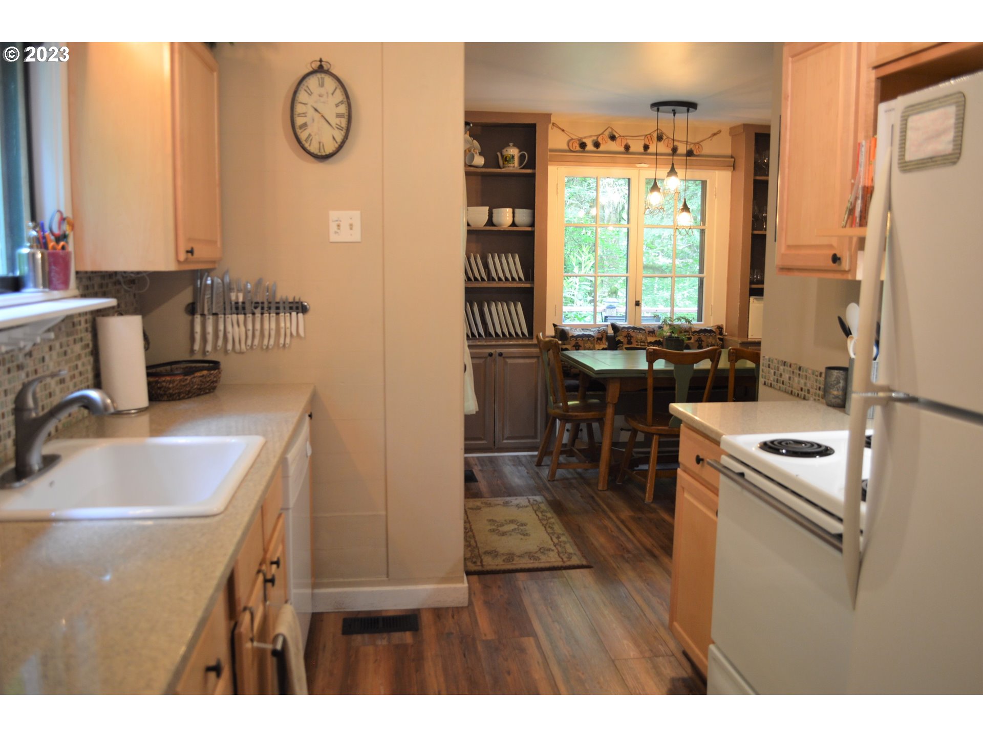 27502 Road 20 Rhododendron, OR 97049 - Photo 12 of 48 a kitchen with a sink stove and refrigerator