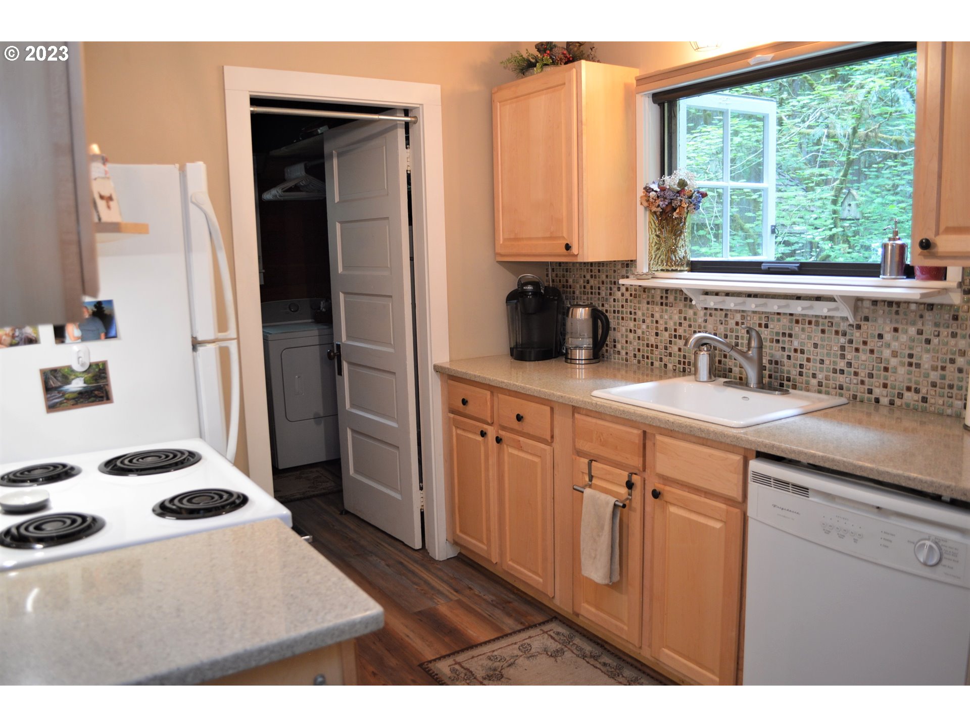 27502 Road 20 Rhododendron, OR 97049 - Photo 13 of 48 a kitchen with a sink stove and refrigerator