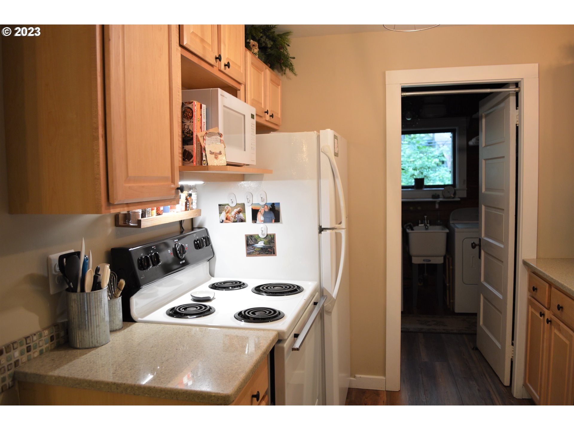 27502 Road 20 Rhododendron, OR 97049 - Photo 15 of 48 a kitchen with a refrigerator a stove and a cabinets