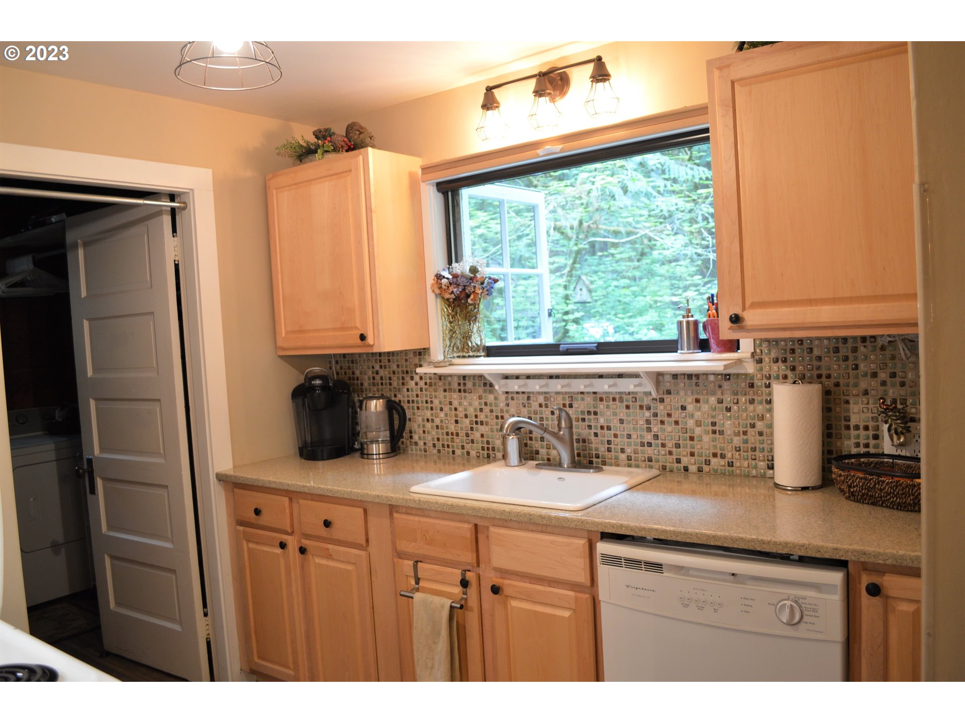27502 Road 20 Rhododendron, OR 97049 - Photo 17 of 48 a kitchen with a sink a counter top space and cabinets