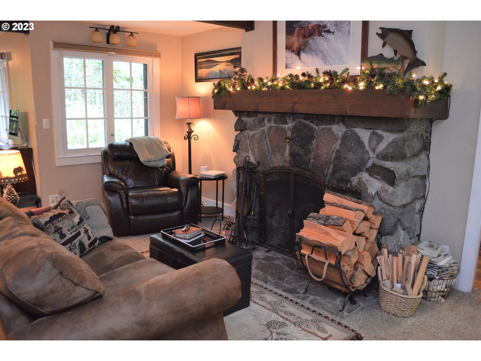27502 Road 20 Rhododendron, OR 97049 - Photo 22 of 48 a living room with furniture and a fireplace