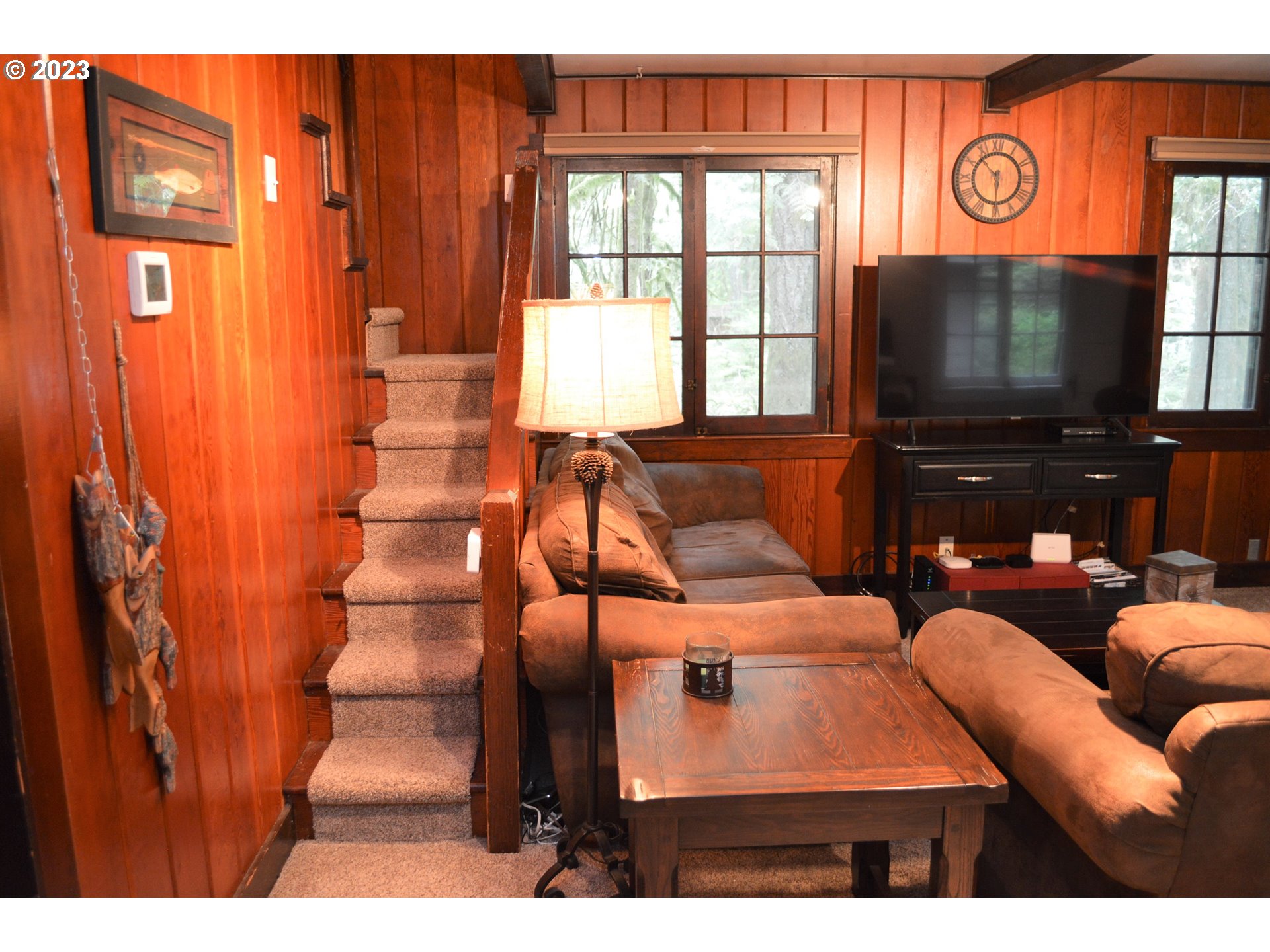 27502 Road 20 Rhododendron, OR 97049 - Photo 32 of 48 a living room with furniture and a flat screen tv