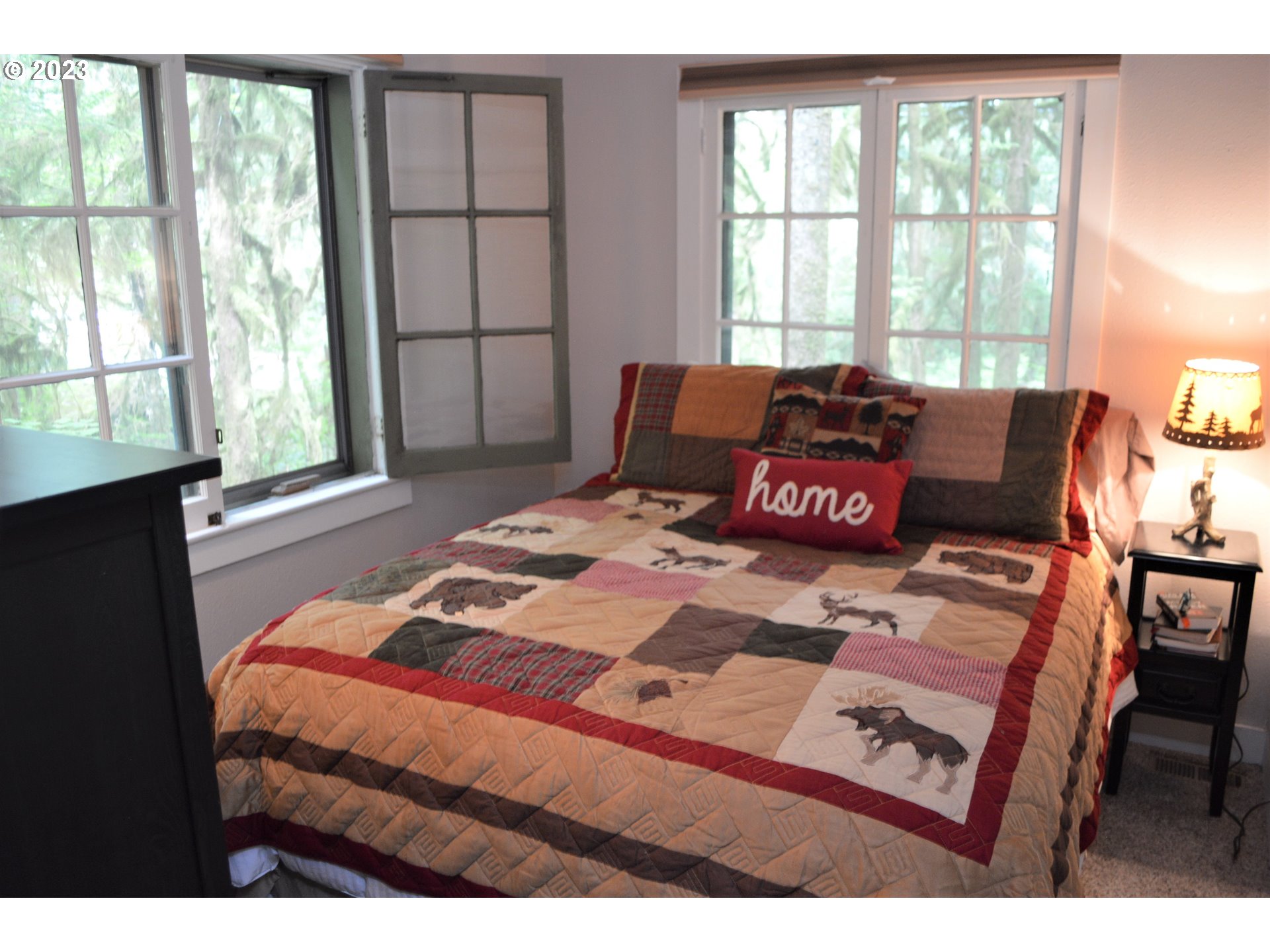 27502 Road 20 Rhododendron, OR 97049 - Photo 33 of 48 a bedroom with a bed window and a table