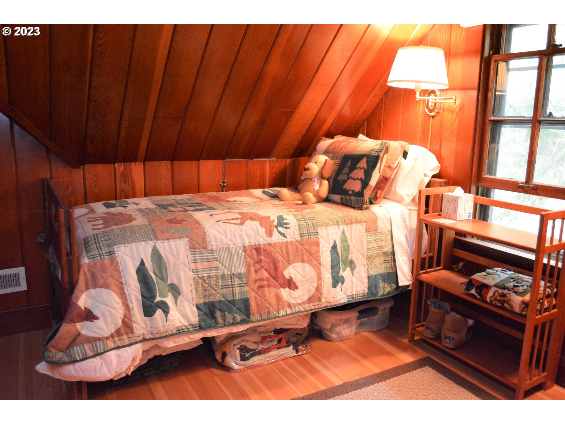 27502 Road 20 Rhododendron, OR 97049 - Photo 38 of 48 a bedroom with a bed and wooden floor