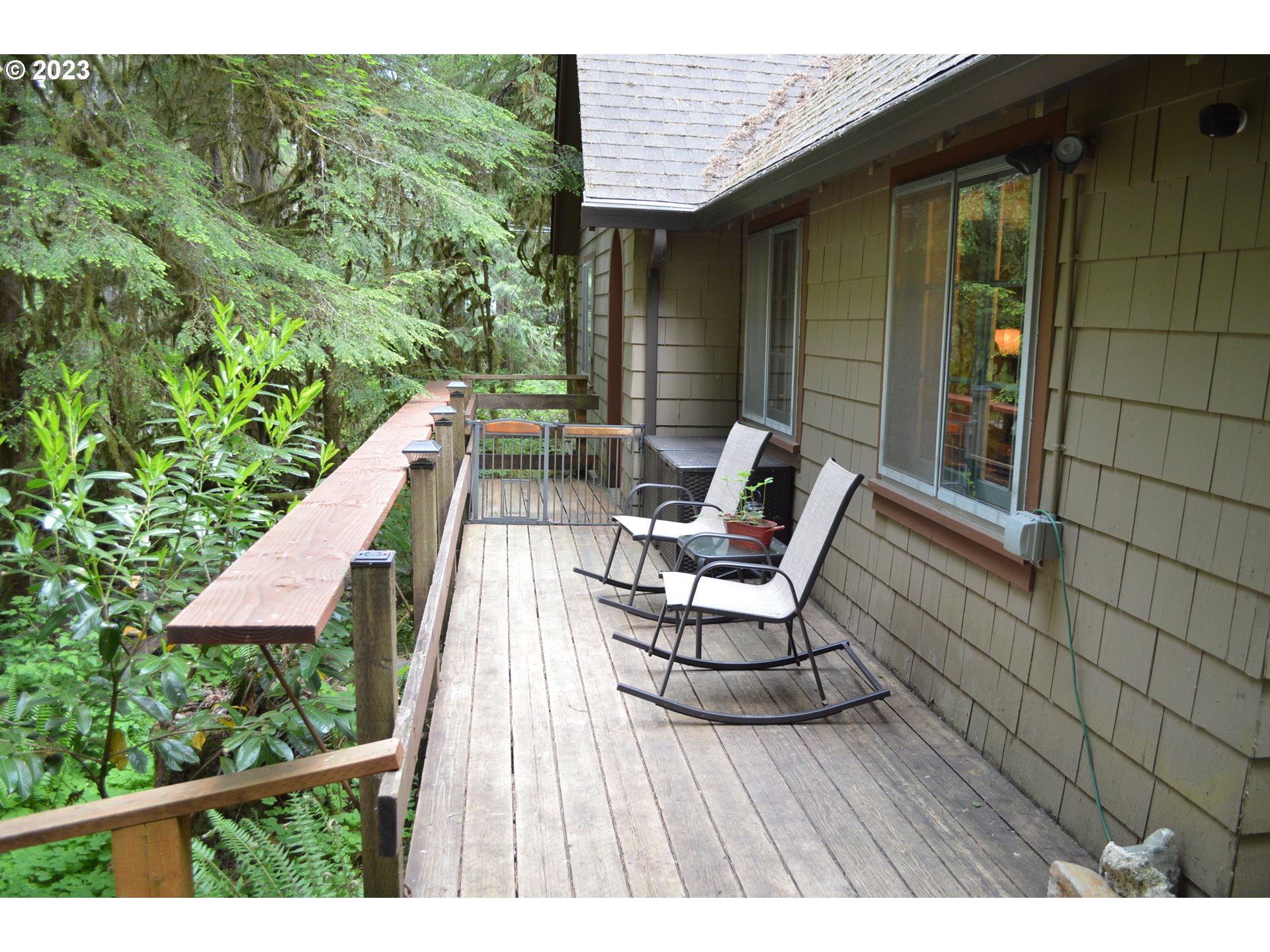 27502 Road 20 Rhododendron, OR 97049 - Photo 6 of 48 a view of balcony with wooden floor and outdoor seating