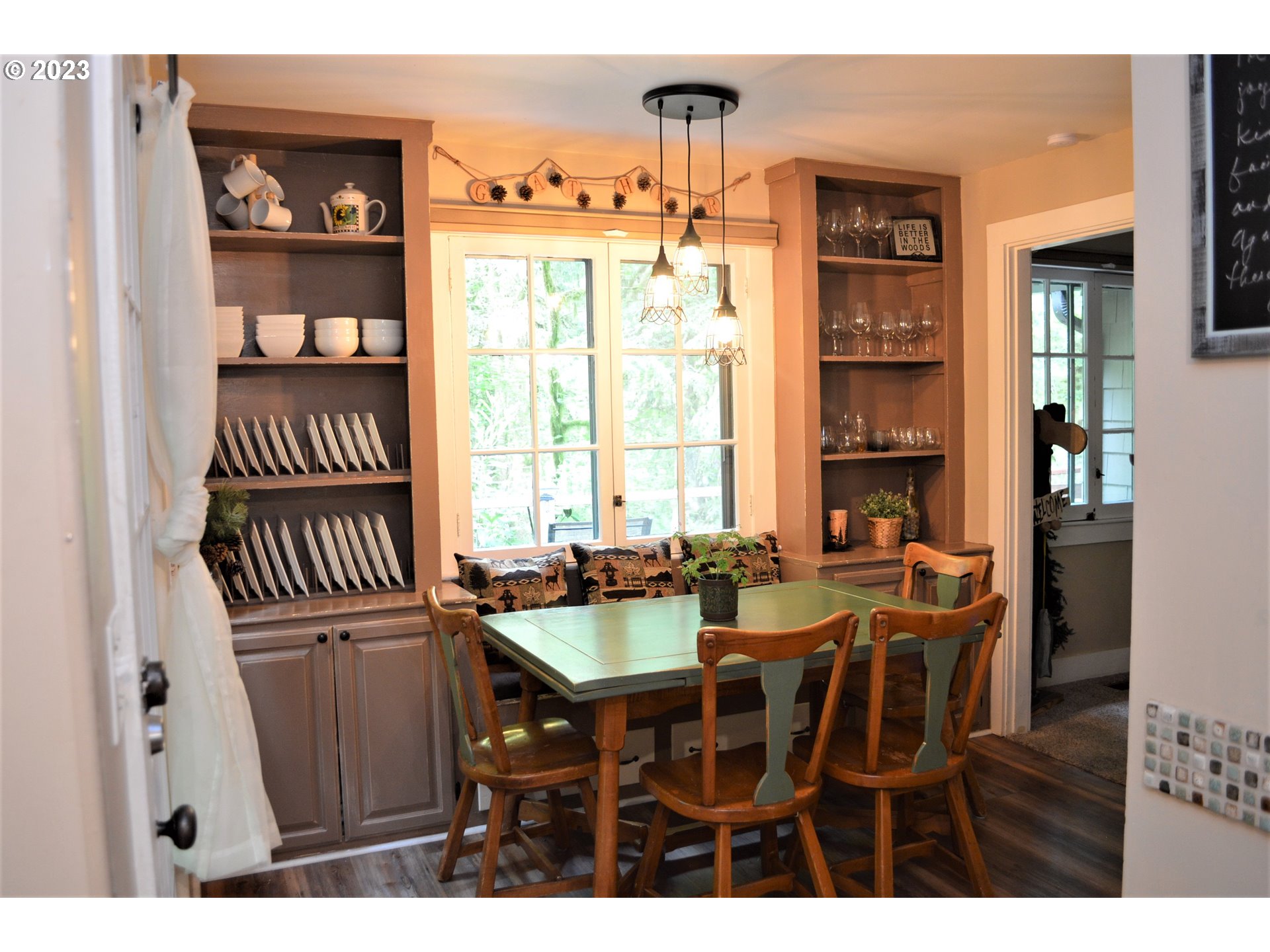 27502 Road 20 Rhododendron, OR 97049 - Photo 10 of 48 a view of a dining room with furniture and a window
