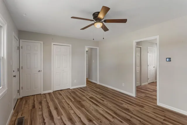 a kitchen with granite countertop a sink appliances and cabinets