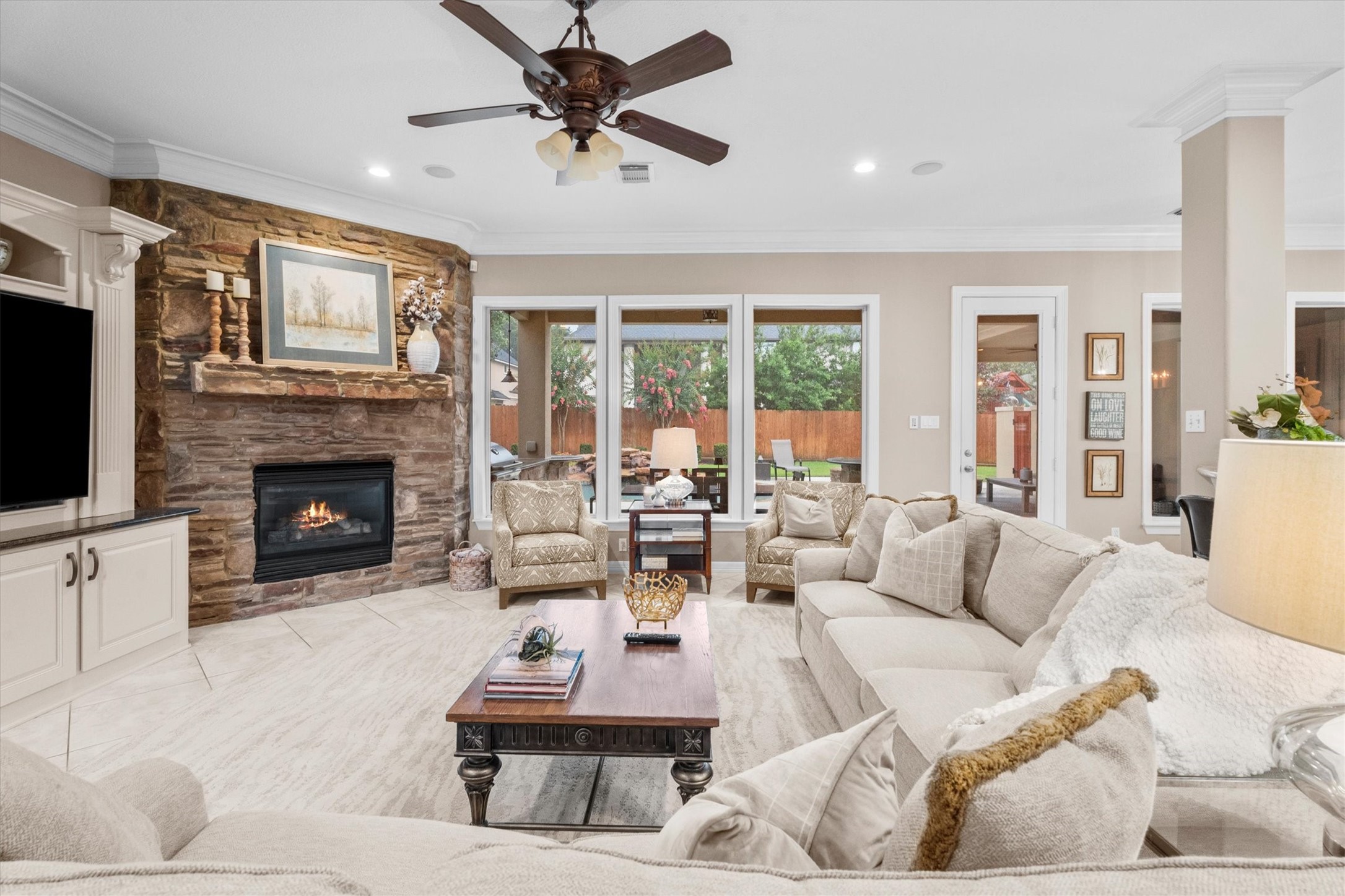 15415 Prade Ranch Lane Cypress, TX 77429 - Photo 14 of 50 The family room offers large picture windows overlooking the outdoor oasis
