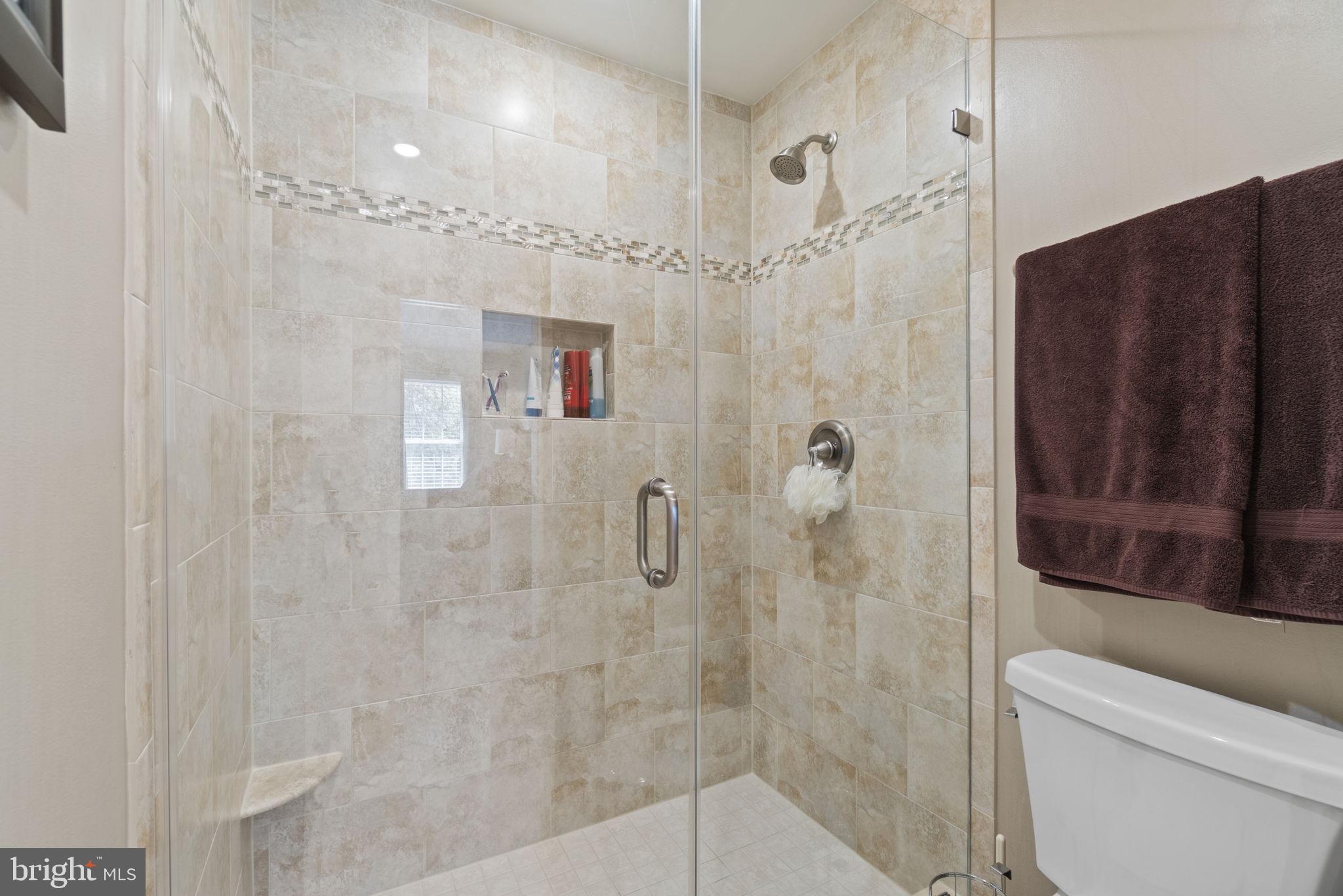 7704 Jewelweed Court Springfield, VA 22152 - Photo 18 of 34 Primary Bathroom Suite w/ Standing Tiled Shower