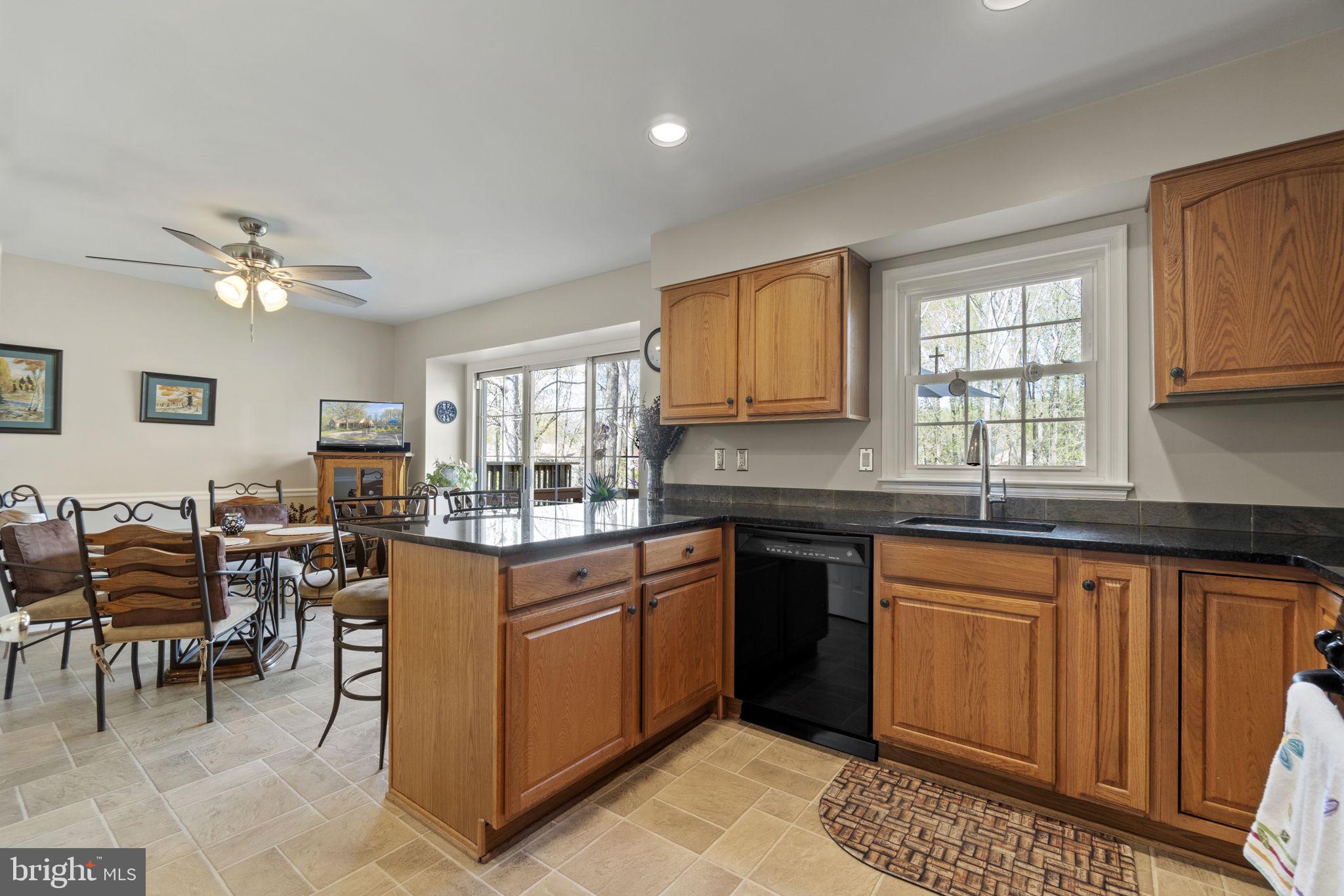 7704 Jewelweed Court Springfield, VA 22152 - Photo 9 of 34 Tiled Kitchen w/ Granite Countertops