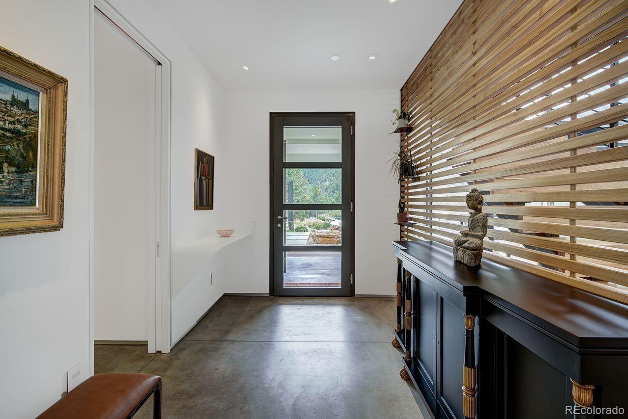 228 Lion Point Boulder, CO 80302 - Photo 14 of 50 a view of an empty room with a fireplace and a window