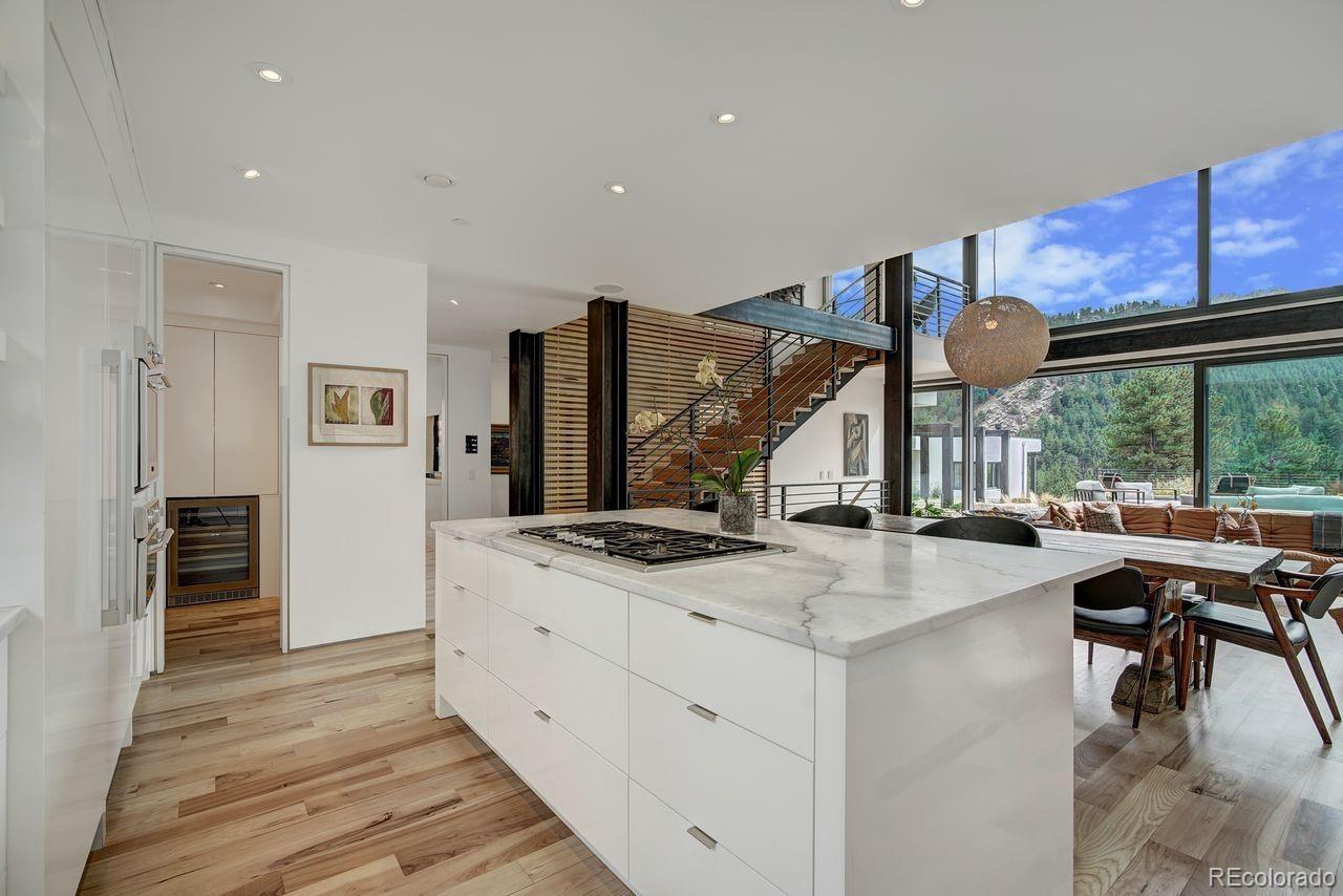 228 Lion Point Boulder, CO 80302 - Photo 16 of 50 a open kitchen with stainless steel appliances granite countertop a sink and a stove