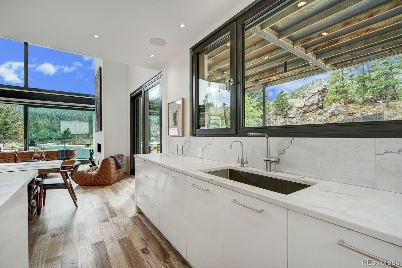 228 Lion Point Boulder, CO 80302 - Photo 17 of 50 a kitchen with a sink and wooden floor