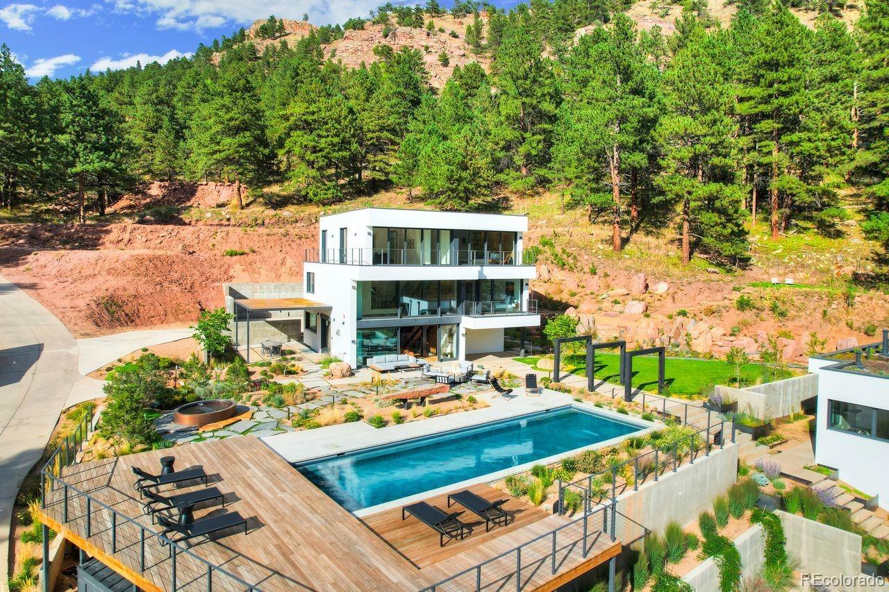 228 Lion Point Boulder, CO 80302 - Photo 2 of 50 a view of a patio with couches table and chairs and potted plants