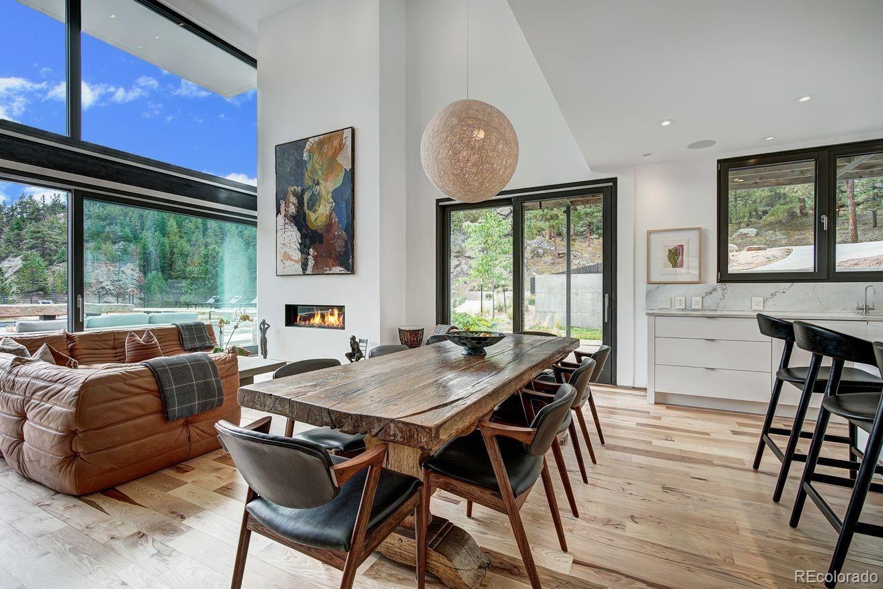 228 Lion Point Boulder, CO 80302 - Photo 21 of 50 a view of a dining room with furniture window and outside view