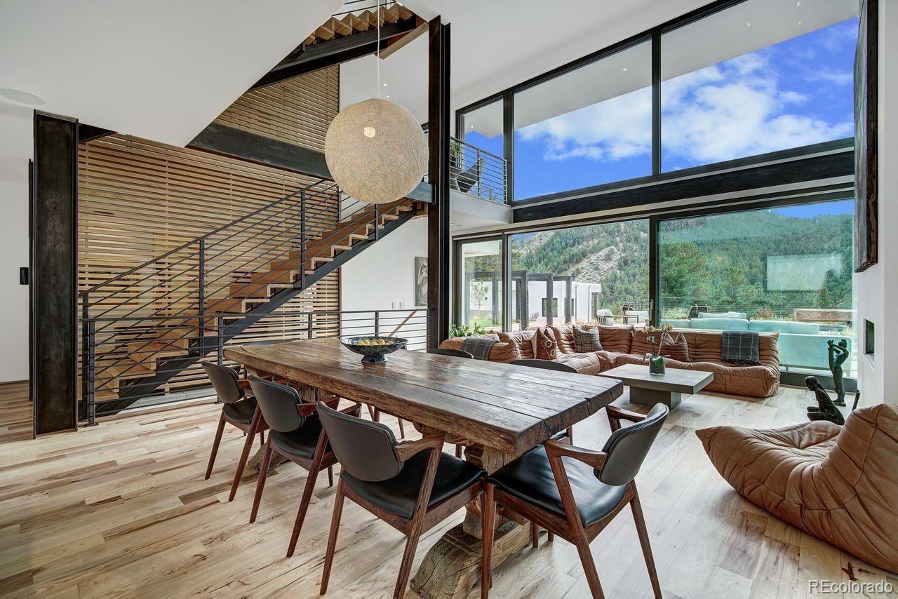 228 Lion Point Boulder, CO 80302 - Photo 22 of 50 a view of a dining room with furniture window and wooden floor