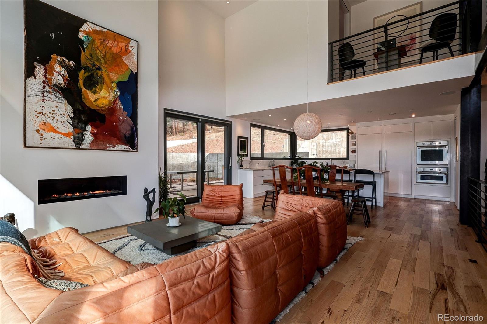 228 Lion Point Boulder, CO 80302 - Photo 25 of 50 a bedroom with furniture and wooden floor