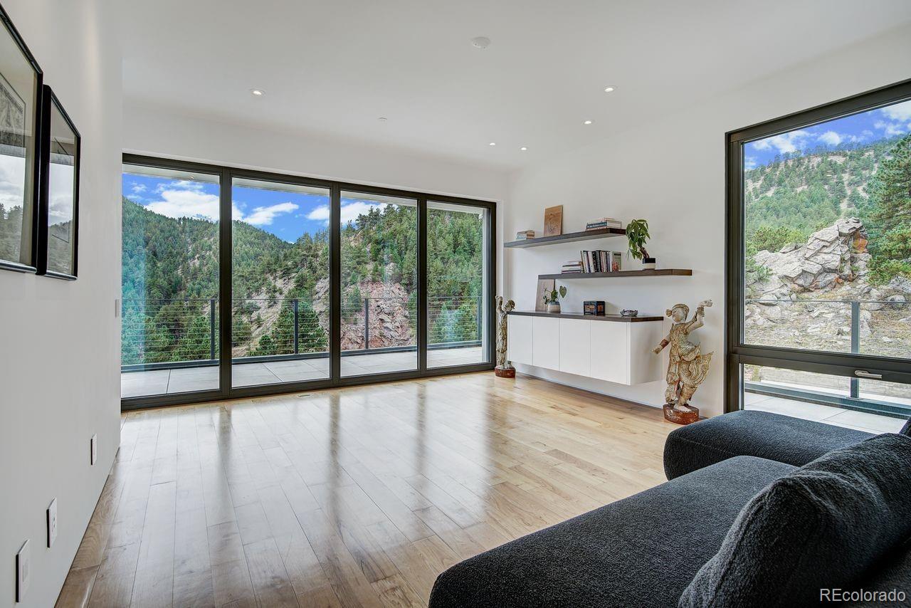 228 Lion Point Boulder, CO 80302 - Photo 28 of 50 a living room with furniture and a large window