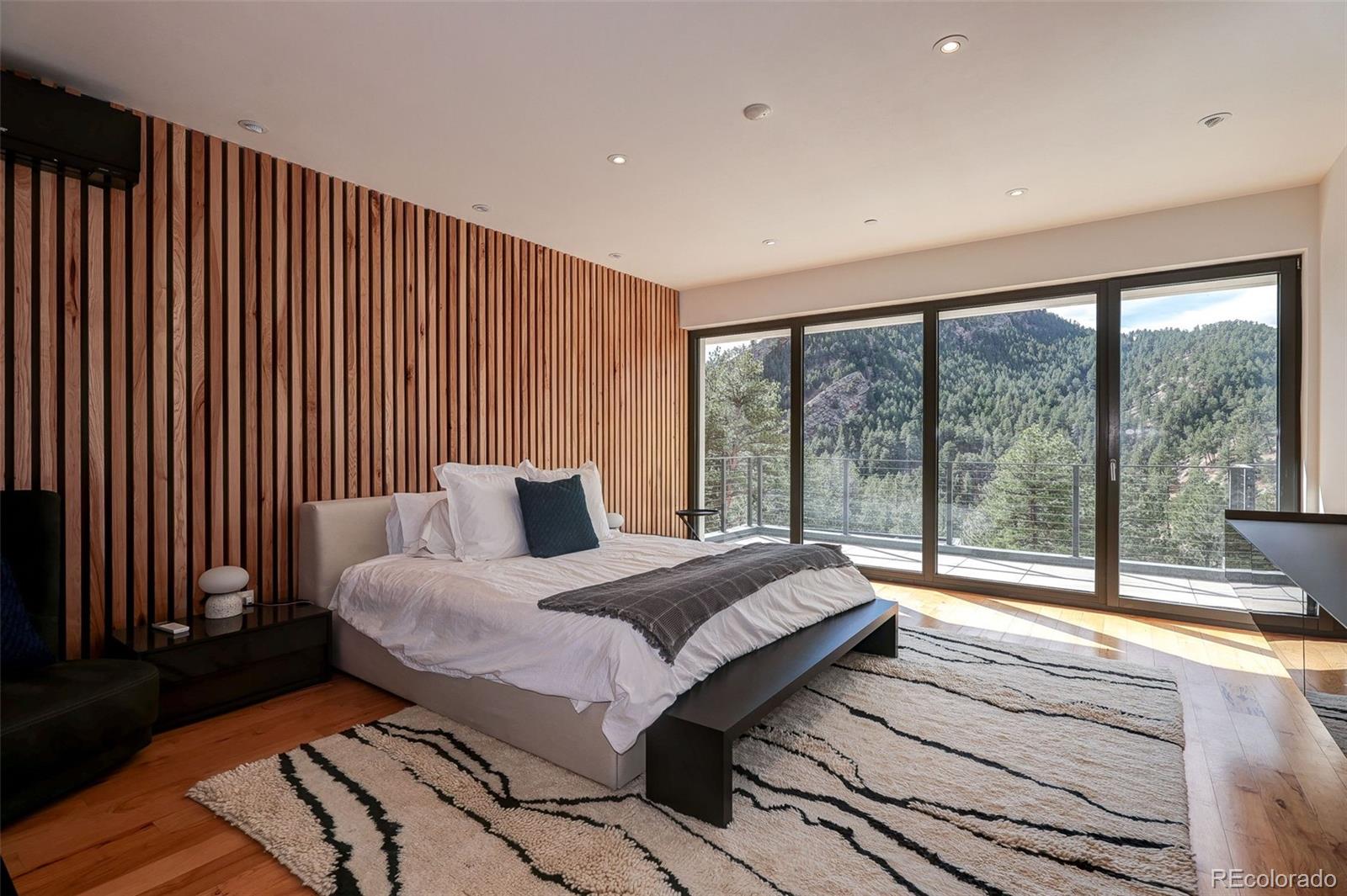 228 Lion Point Boulder, CO 80302 - Photo 29 of 50 a bedroom with a bed and a large window