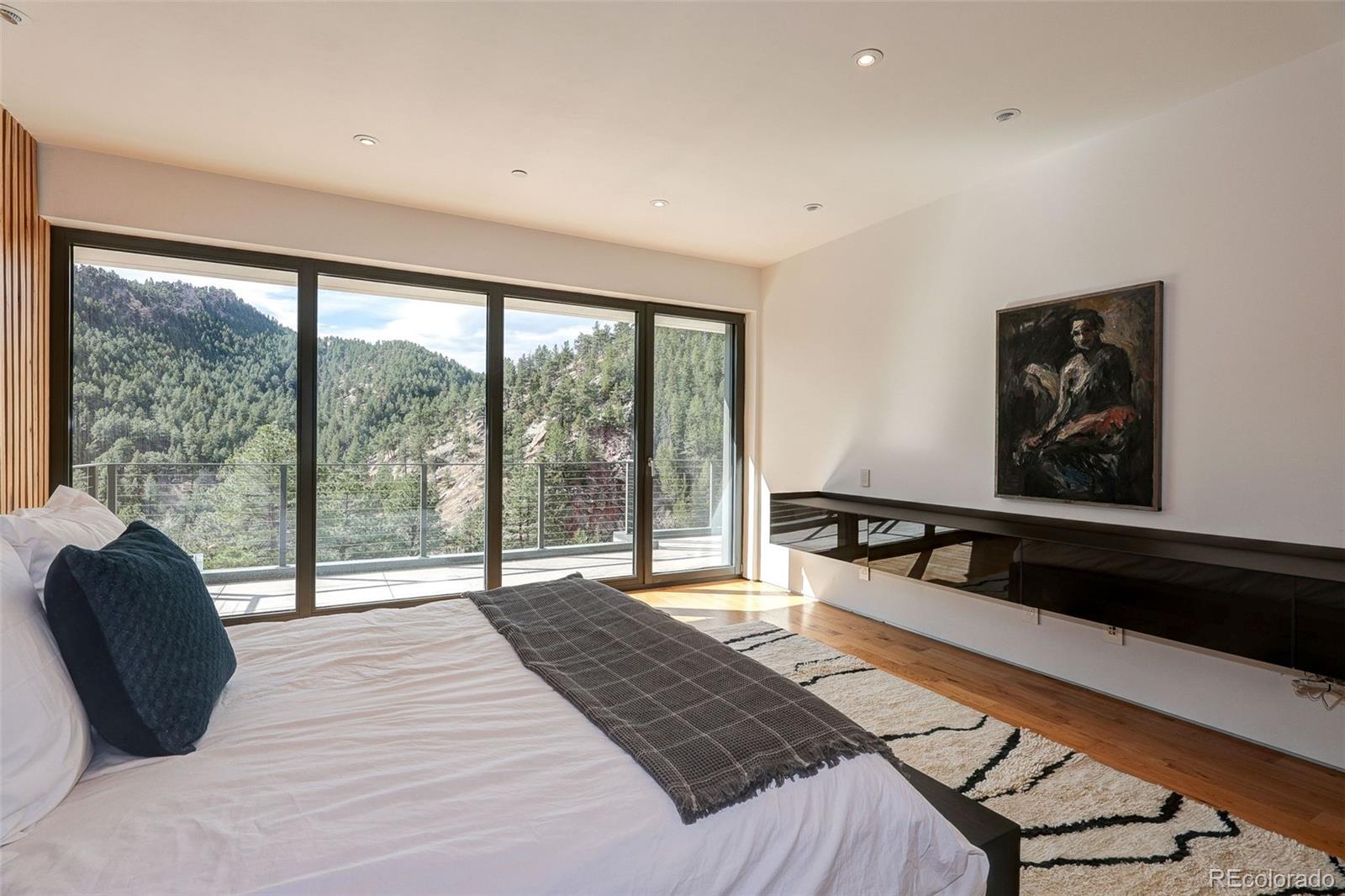 228 Lion Point Boulder, CO 80302 - Photo 30 of 50 a bedroom with a bed and a large window