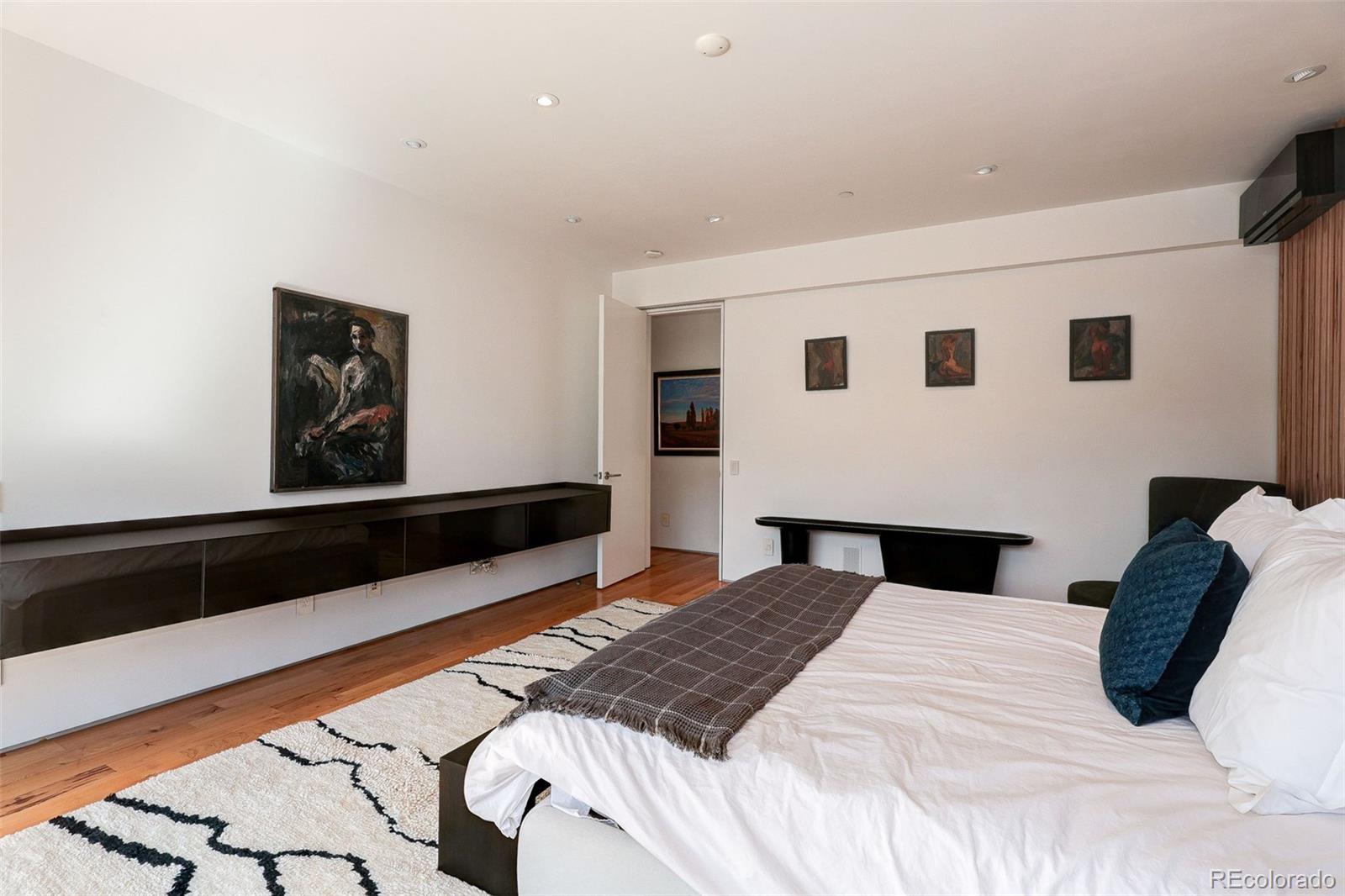 228 Lion Point Boulder, CO 80302 - Photo 31 of 50 a bedroom with a large bed and a large window