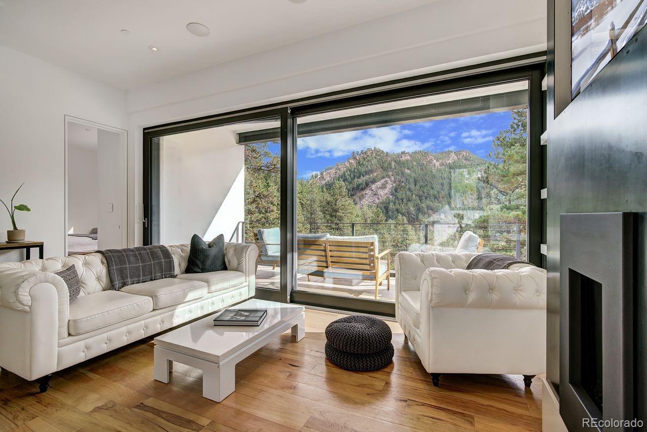 228 Lion Point Boulder, CO 80302 - Photo 32 of 50 a living room with furniture and a large window