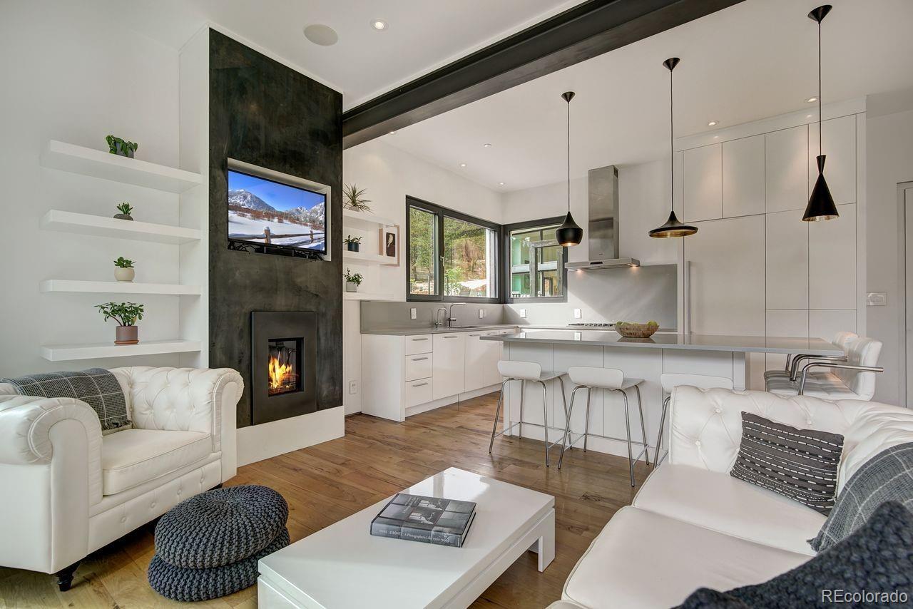 228 Lion Point Boulder, CO 80302 - Photo 33 of 50 a living room with furniture and a fireplace