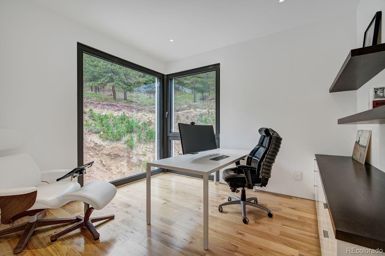 228 Lion Point Boulder, CO 80302 - Photo 37 of 50 a view of a workspace with furniture and a window