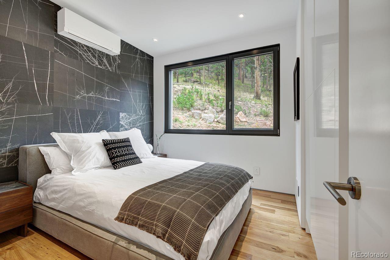 228 Lion Point Boulder, CO 80302 - Photo 40 of 50 a bedroom with a bed and a window