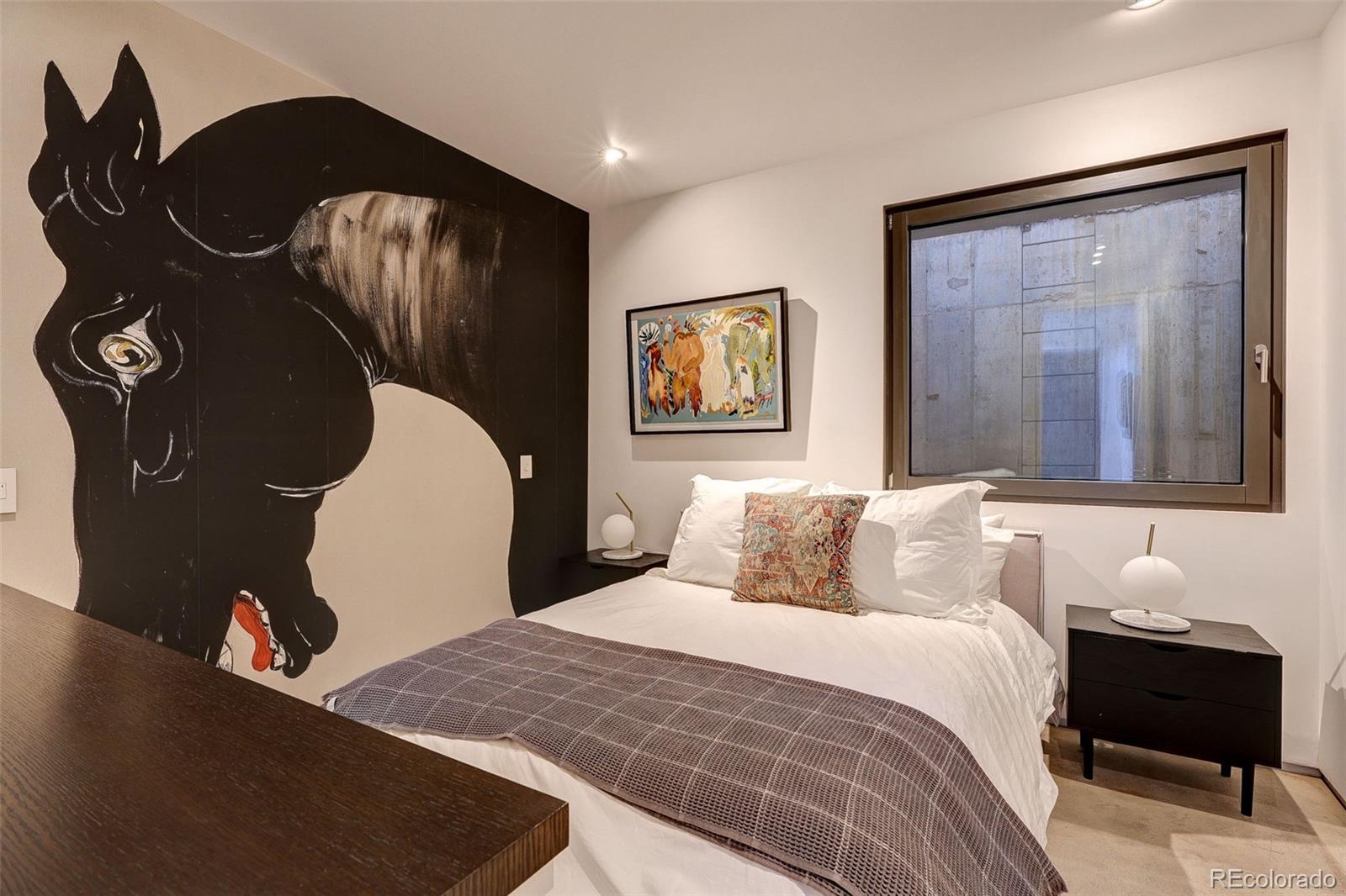 228 Lion Point Boulder, CO 80302 - Photo 42 of 50 a bedroom with a bed and painting on the wall