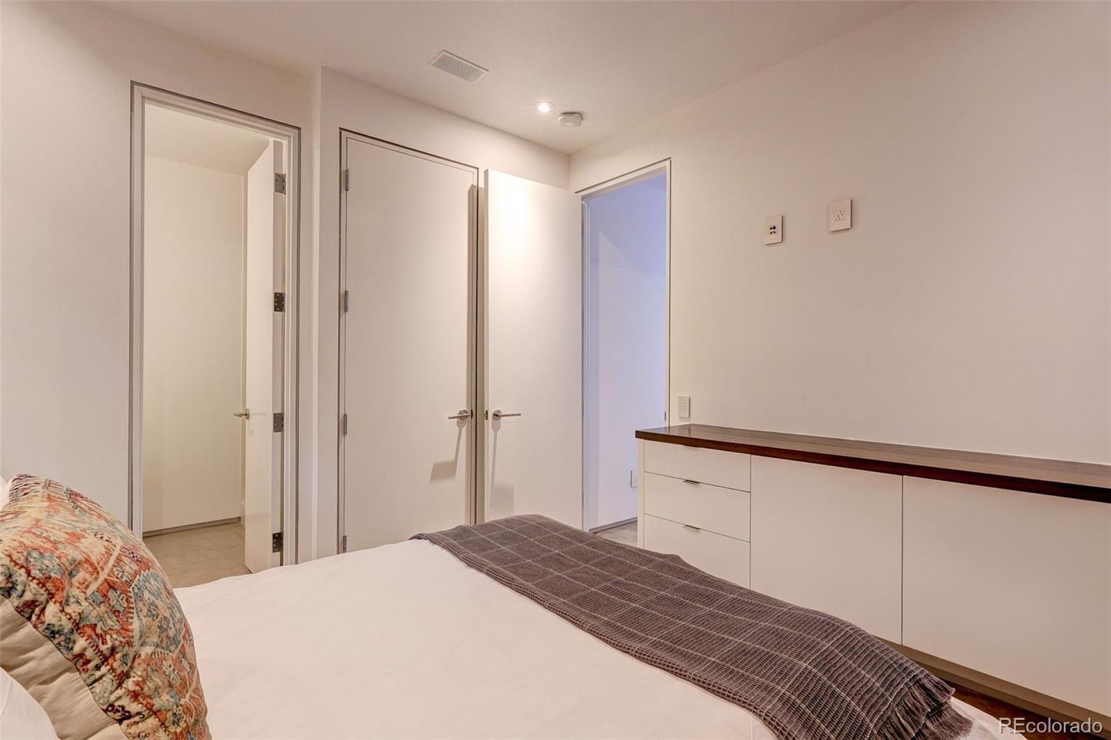 228 Lion Point Boulder, CO 80302 - Photo 43 of 50 a bedroom with a bed and a mirror