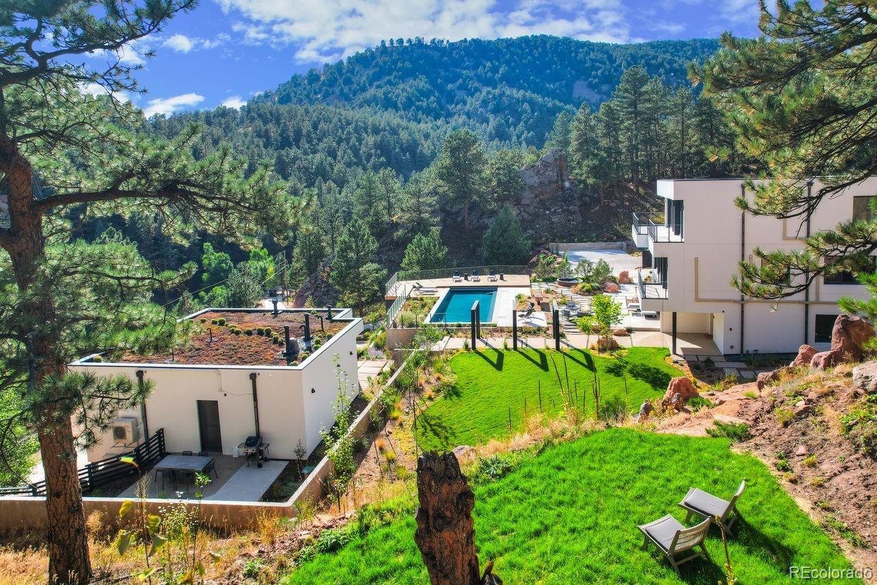 228 Lion Point Boulder, CO 80302 - Photo 5 of 50 a view of a backyard with plants and lake view