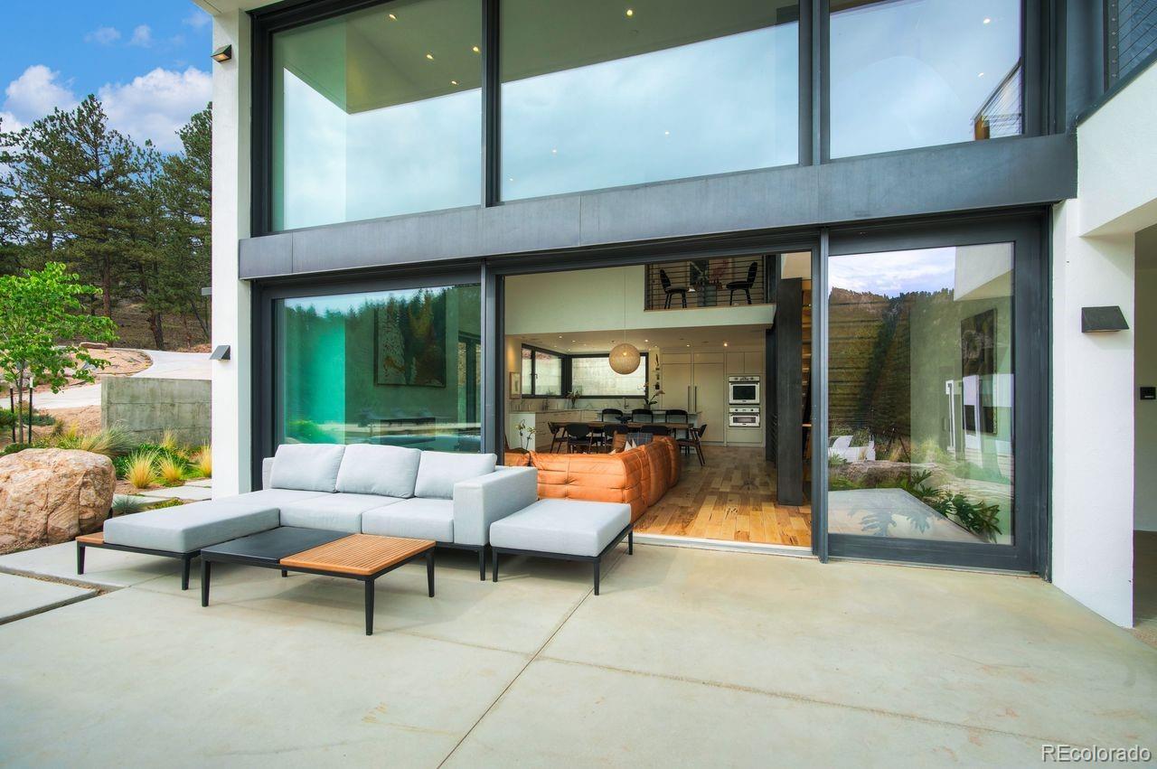 228 Lion Point Boulder, CO 80302 - Photo 8 of 50 a outdoor space with patio couch and a potted plant