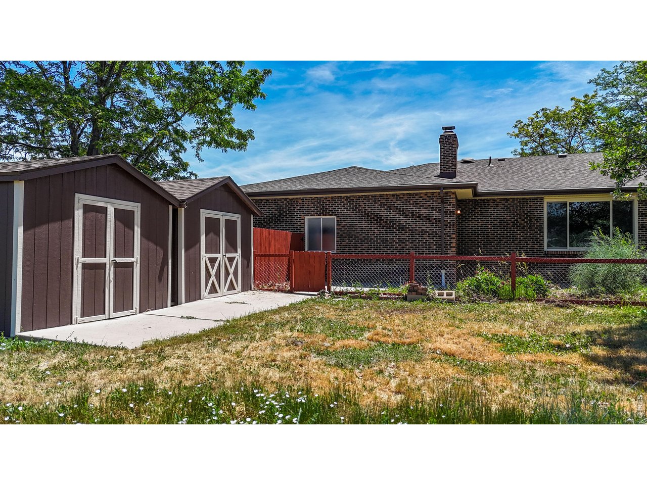 2800 Pheasant Run Berthoud, CO 80513 - Photo 44 of 50 2 Sheds/fenced patio area